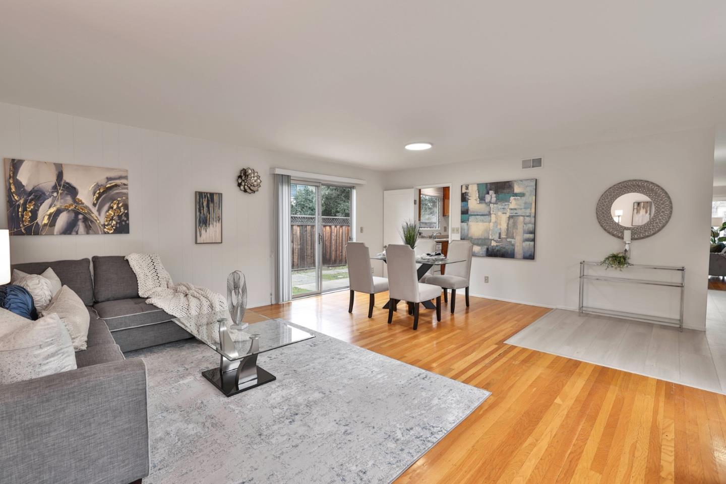10326 Cherry Tree Lane Cupertino, CA 95014 - Photo 13 of 32 a living room with furniture