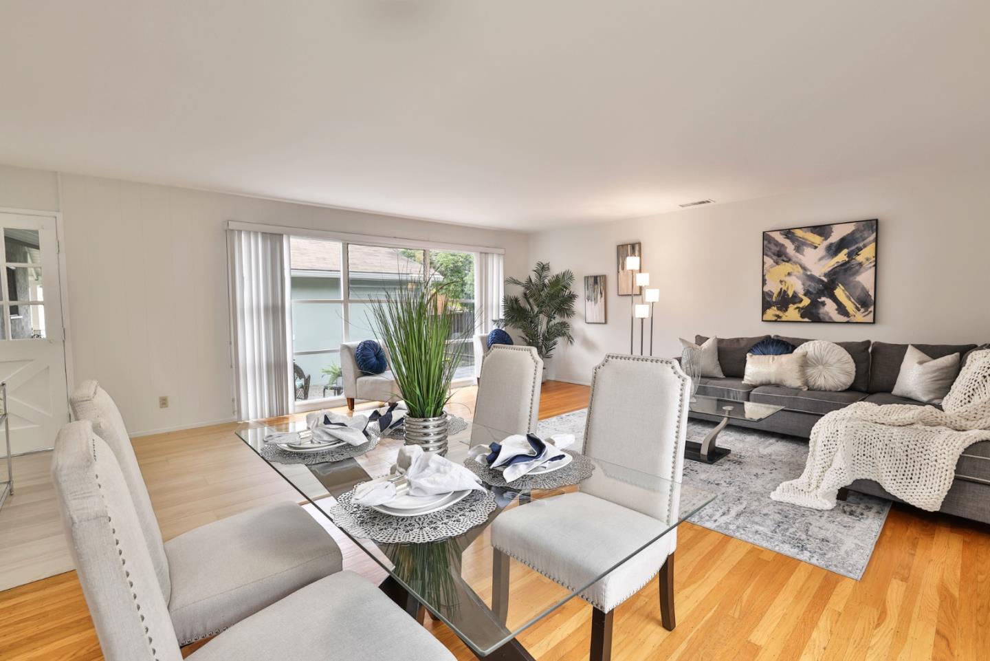 10326 Cherry Tree Lane Cupertino, CA 95014 - Photo 15 of 32 a living room with furniture and a large window
