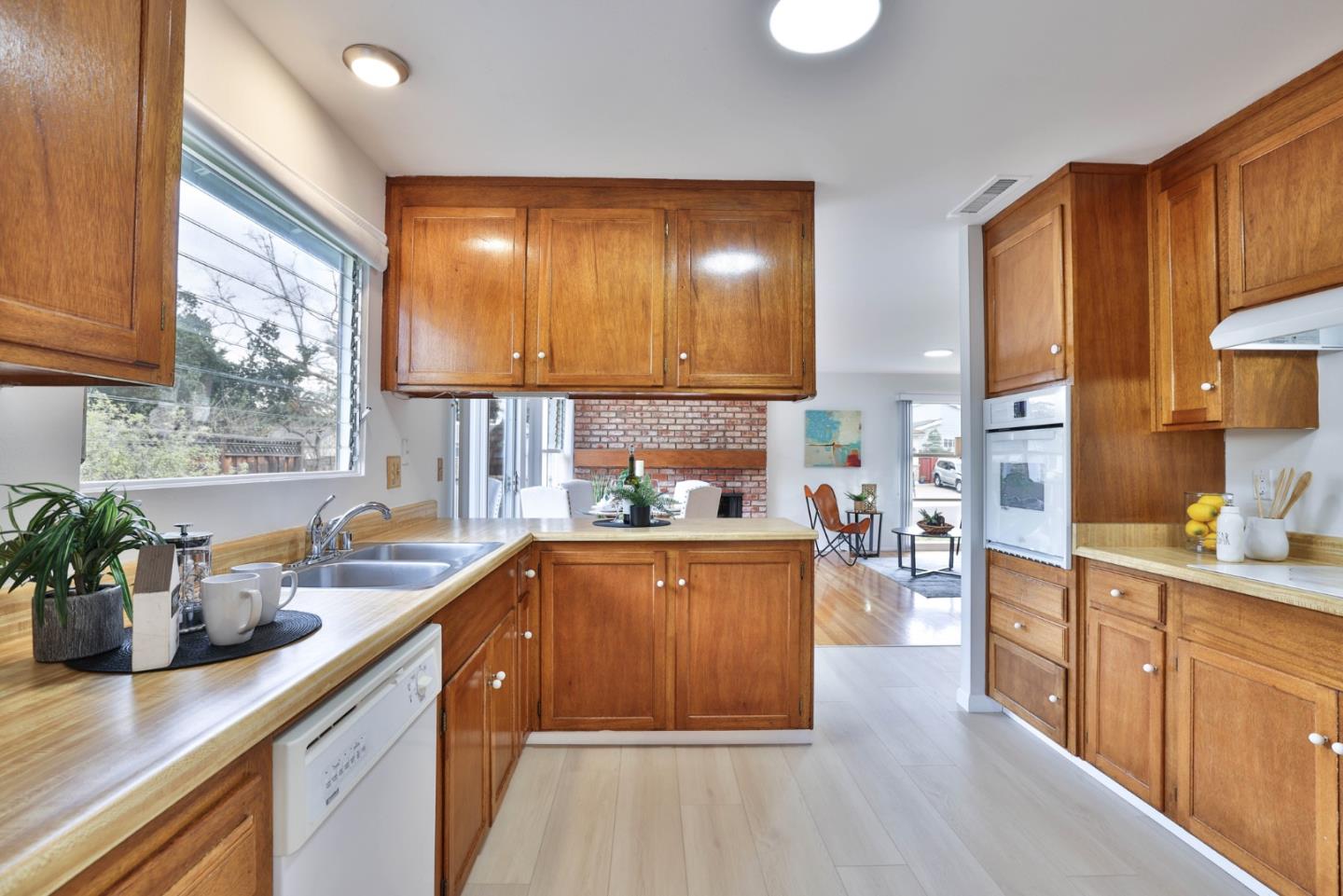 10326 Cherry Tree Lane Cupertino, CA 95014 - Photo 16 of 32 a kitchen with lots of counter top space and wooden floor