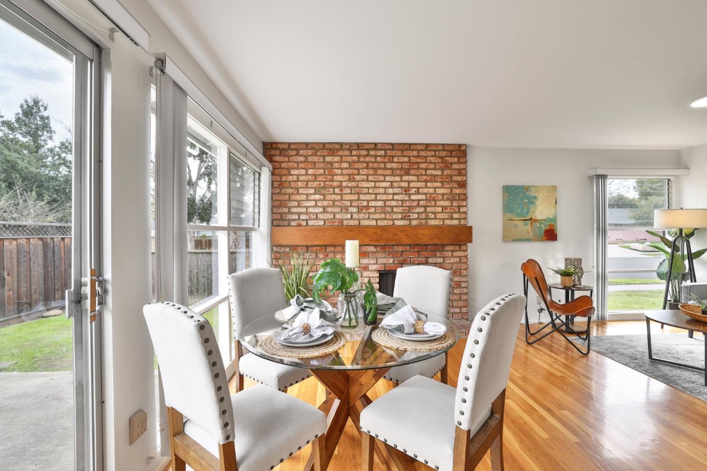 10326 Cherry Tree Lane Cupertino, CA 95014 - Photo 19 of 32 a view of a dining room with furniture window and wooden floor