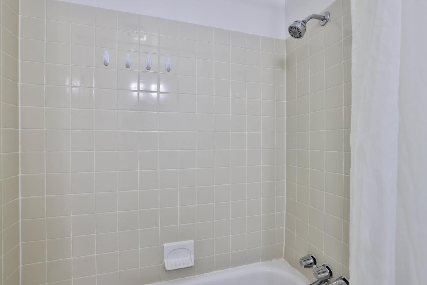 10326 Cherry Tree Lane Cupertino, CA 95014 - Photo 22 of 32 a bathroom with a shower