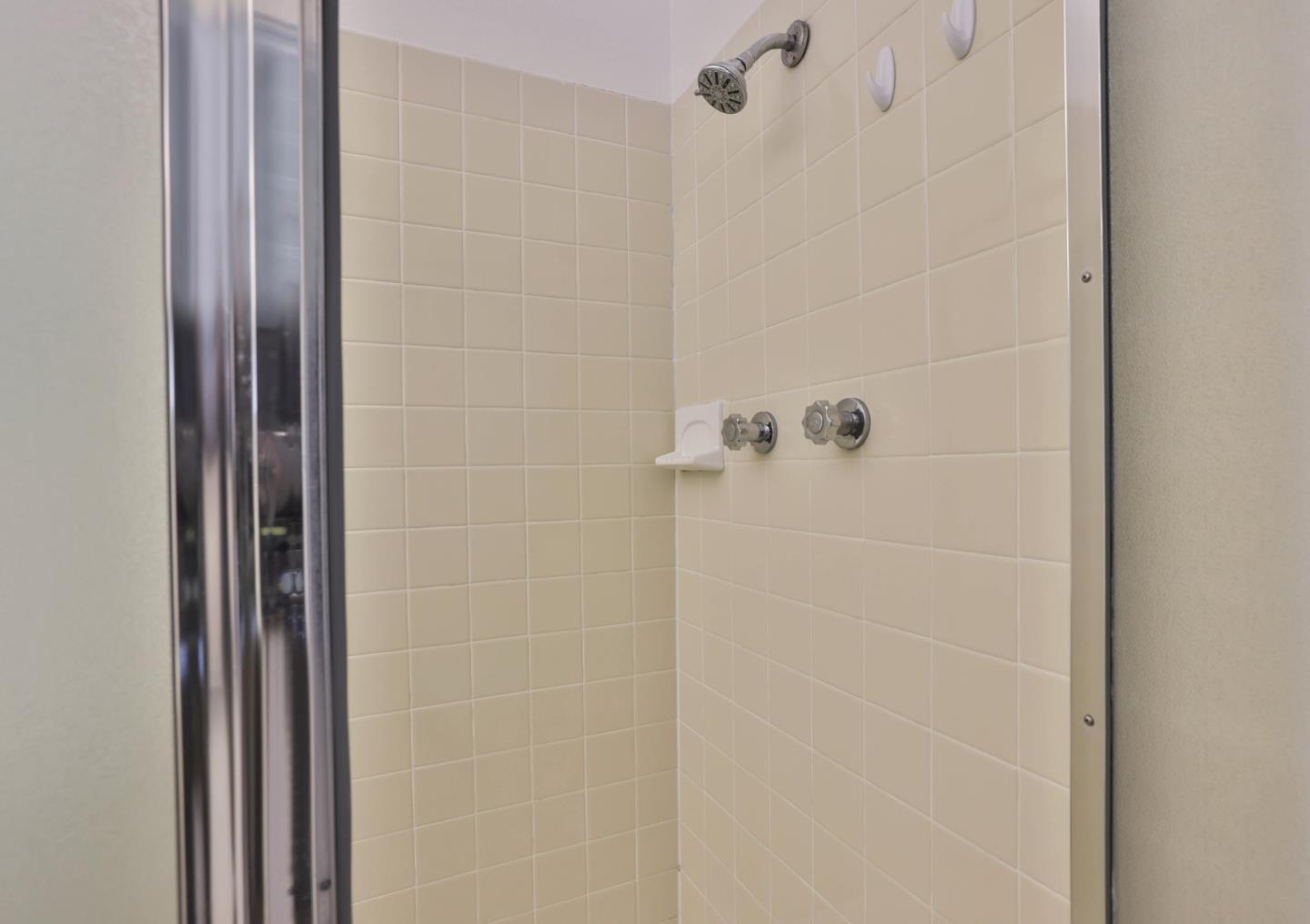 10326 Cherry Tree Lane Cupertino, CA 95014 - Photo 28 of 32 a bathroom with a shower