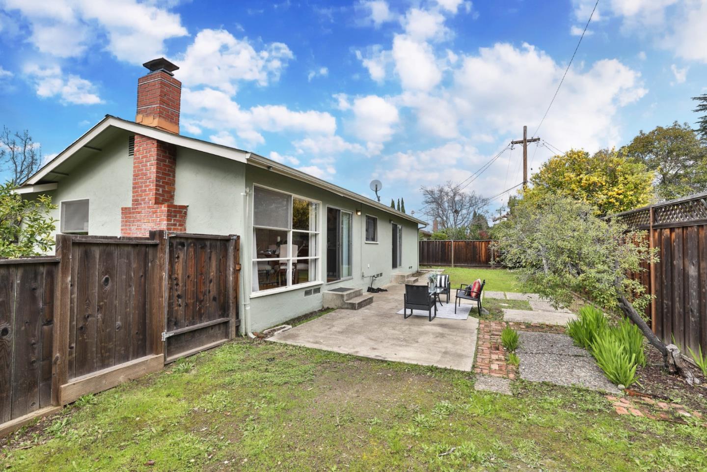 10326 Cherry Tree Lane Cupertino, CA 95014 - Photo 30 of 32 a front view of a house with garden