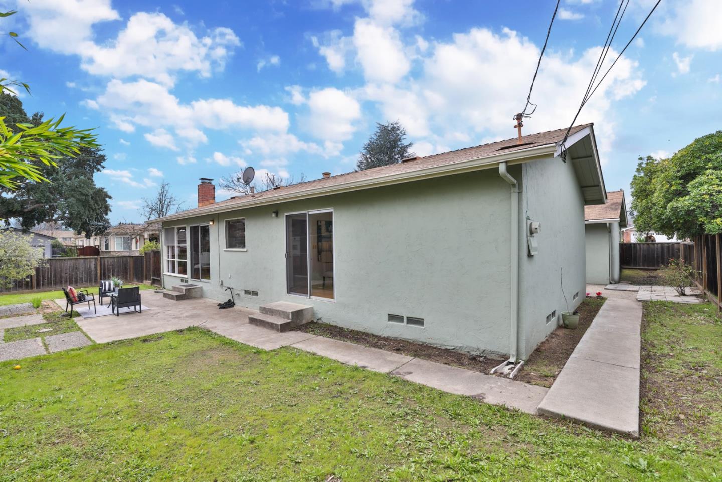 10326 Cherry Tree Lane Cupertino, CA 95014 - Photo 32 of 32 a backyard of a house with table and chairs