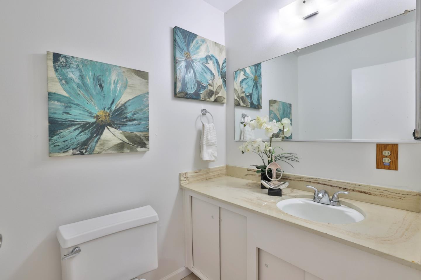 10326 Cherry Tree Lane Cupertino, CA 95014 - Photo 9 of 32 a bathroom with a toilet sink and mirror