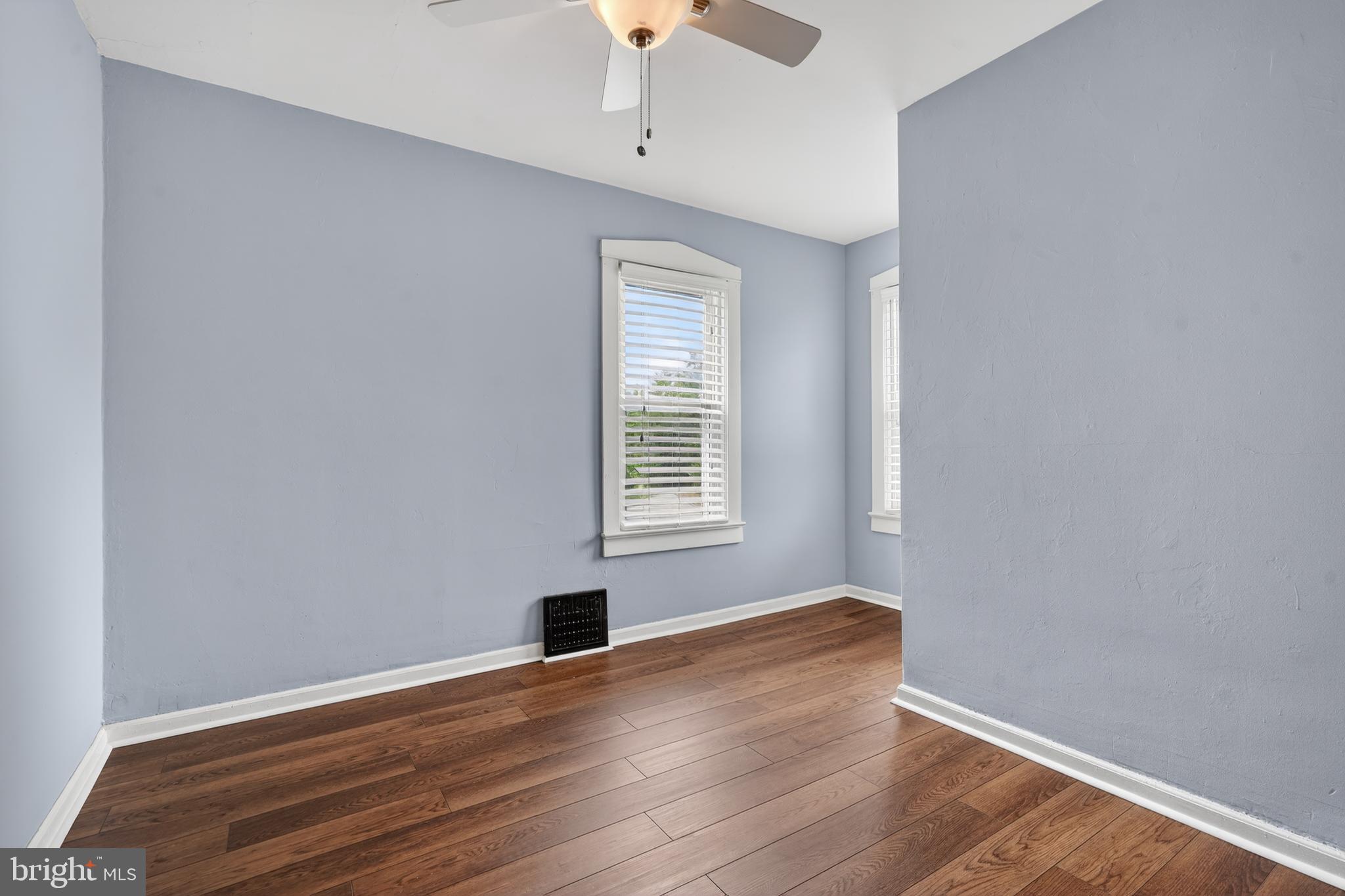 106 Ford Street Voorhees, NJ 08043 - Photo 21 of 36 a view of an empty room with wooden floor and a window