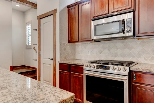a view of hallway with wooden floor