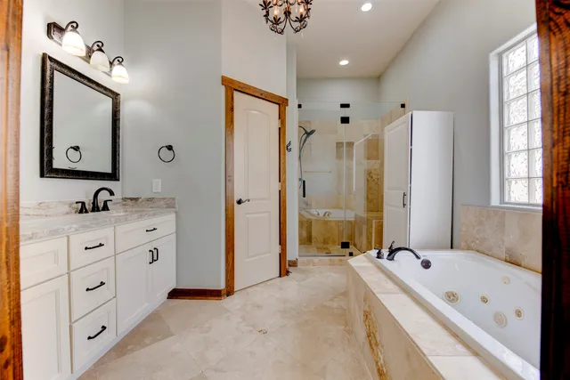 a bathroom with a bathtub and shower