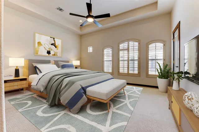 a bedroom with a balcony a bed and a chandelier