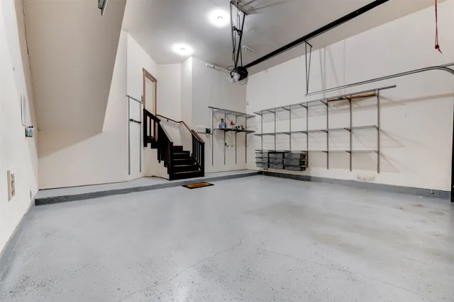 a view of garage with stairs