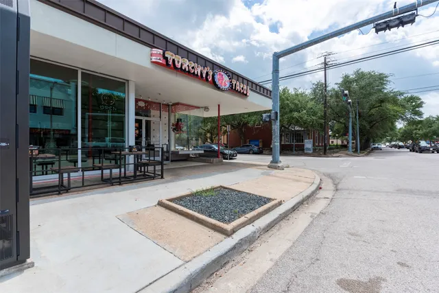 a outdoor space with lots of windows and plants