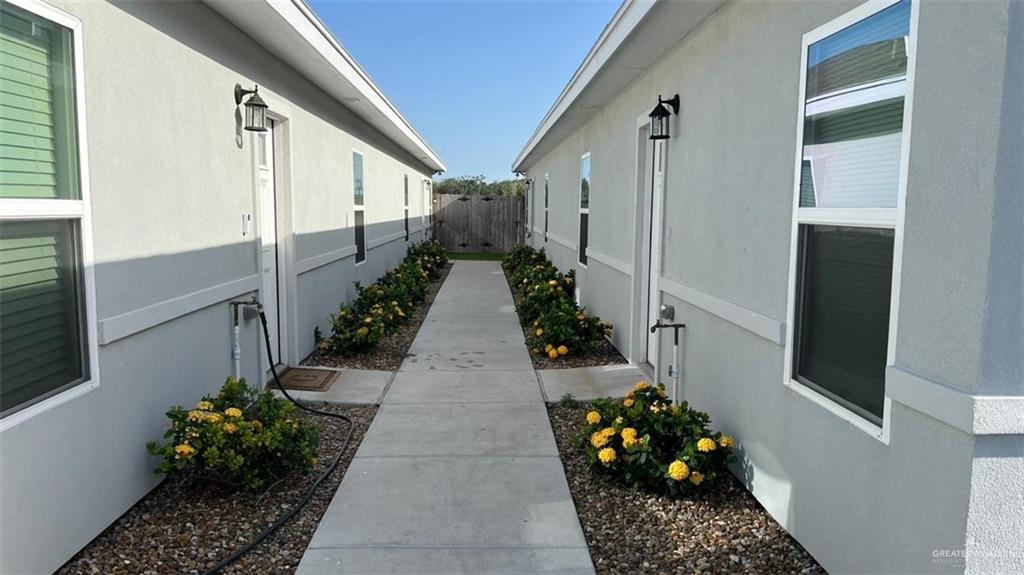 2108 Redbud Lane, Unit 4 Weslaco, TX 78596 - Photo 5 of 5 a hallway with flowers and flowers