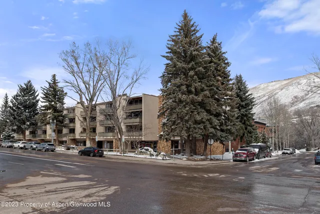 a view of a street with a building in the background