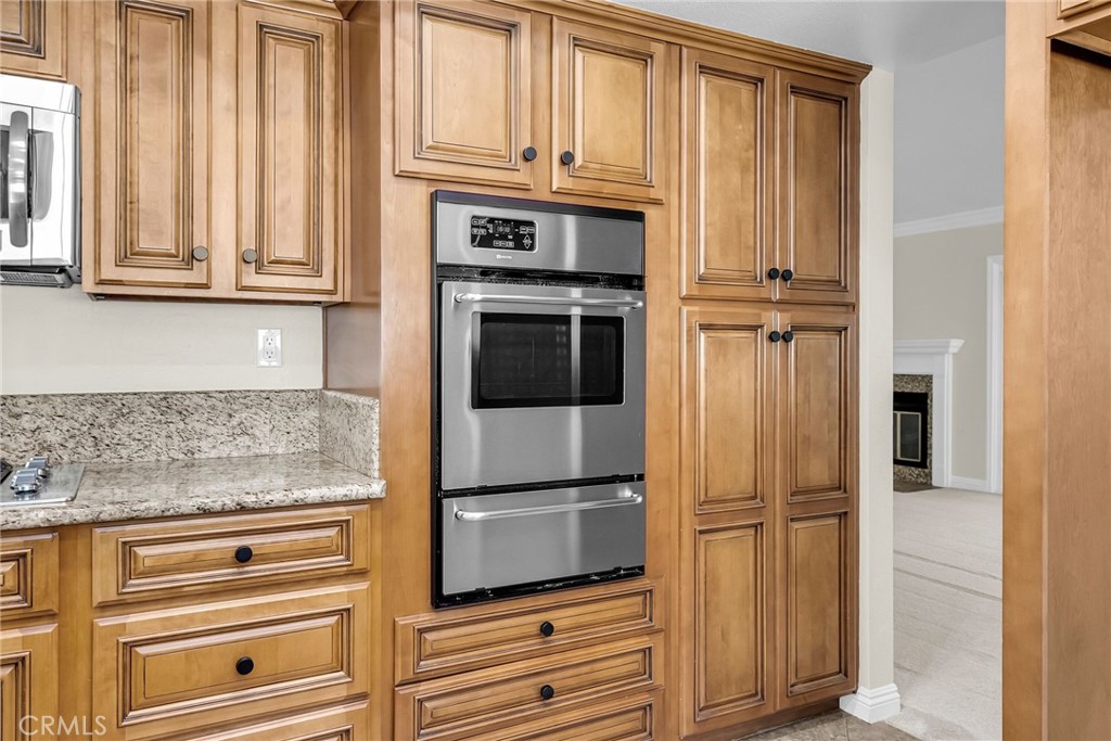 510 Vía Zapata Riverside, CA 92507 - Photo 11 of 47 a kitchen with granite countertop stainless steel appliances and cabinets