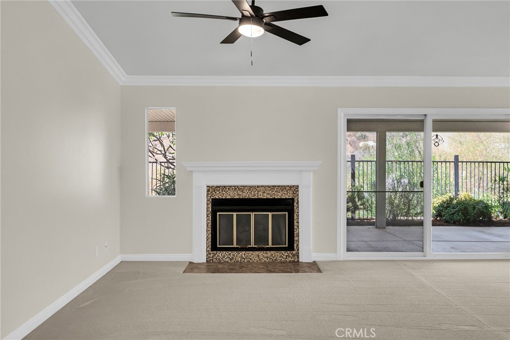 510 Vía Zapata Riverside, CA 92507 - Photo 19 of 47 a living room with a fireplace and a large window