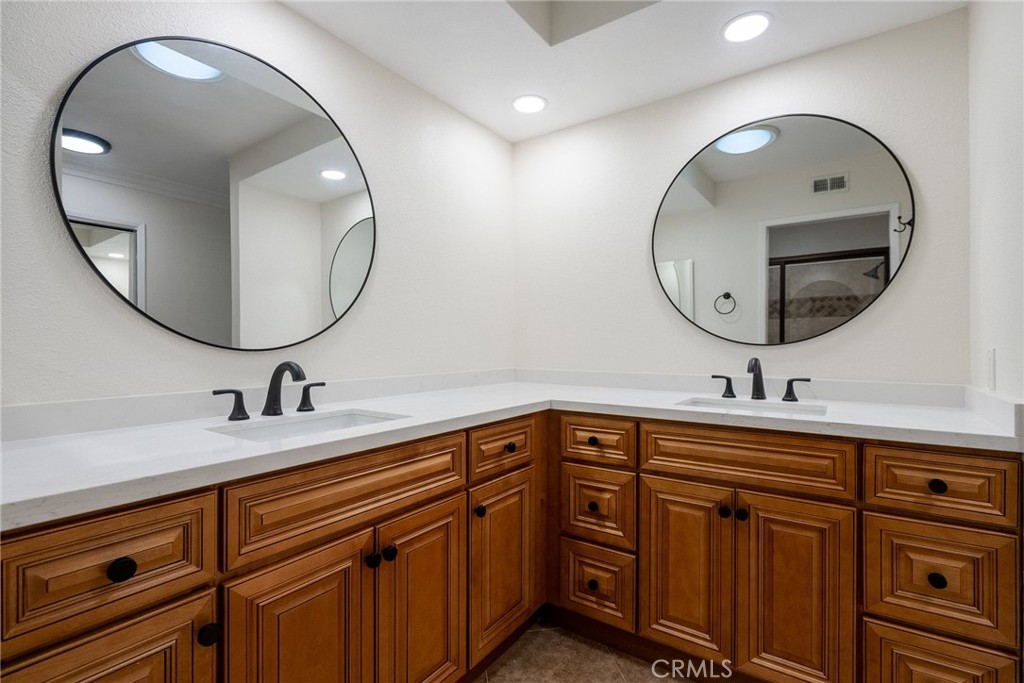 510 Vía Zapata Riverside, CA 92507 - Photo 24 of 47 a bathroom with a sink and a mirror