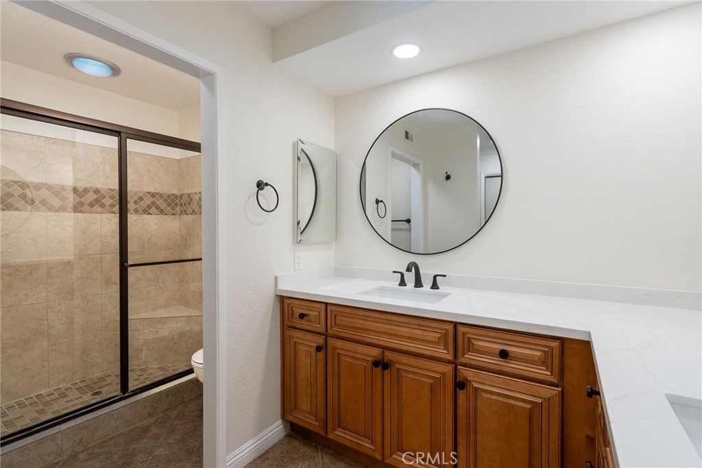 510 Vía Zapata Riverside, CA 92507 - Photo 25 of 47 a bathroom with a sink and a mirror