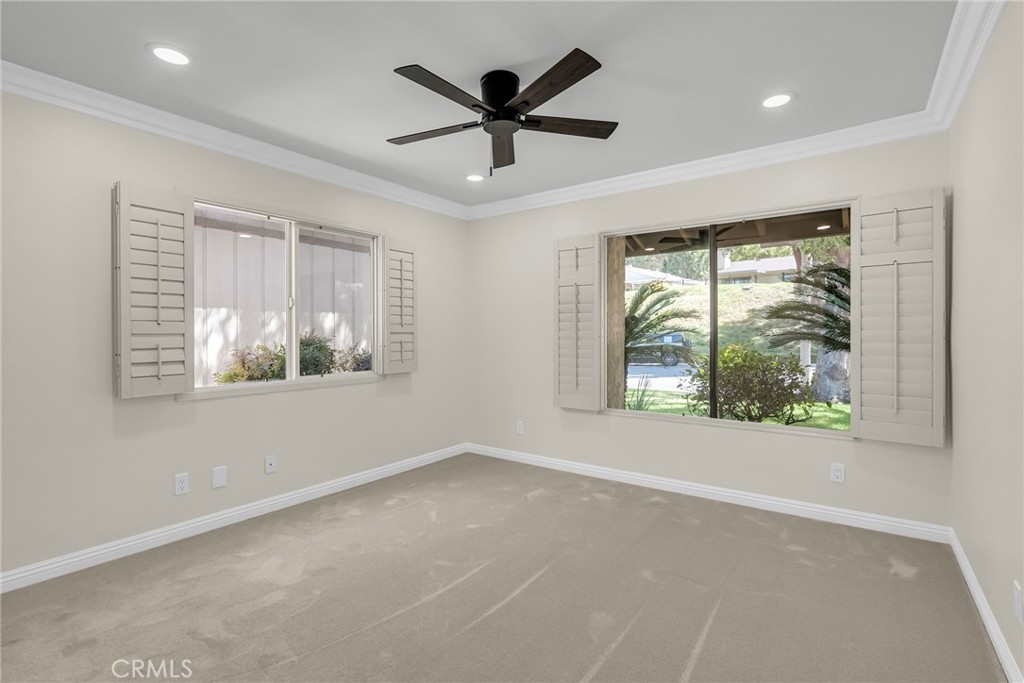 510 Vía Zapata Riverside, CA 92507 - Photo 27 of 47 an empty room with wooden floor and windows
