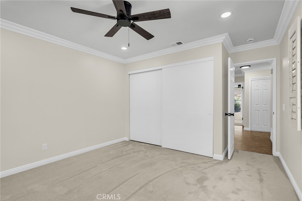 510 Vía Zapata Riverside, CA 92507 - Photo 28 of 47 an empty room with closet and a ceiling fan