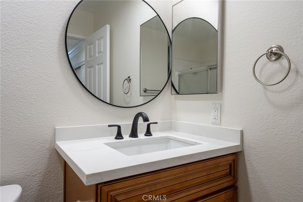 510 Vía Zapata Riverside, CA 92507 - Photo 29 of 47 a bathroom with a sink and a mirror