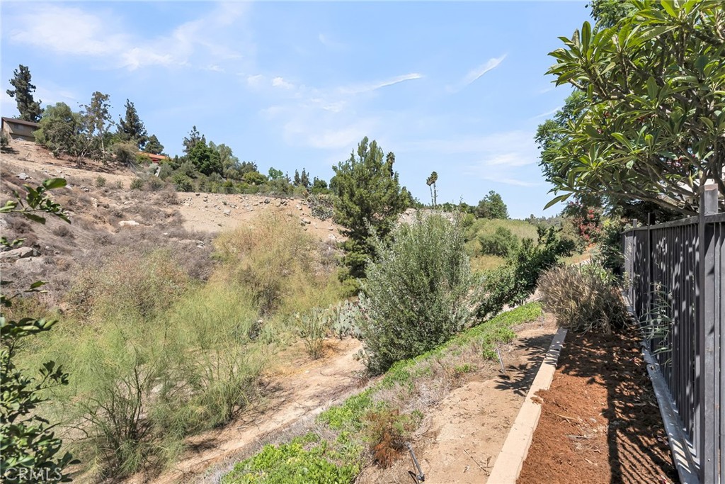 510 Vía Zapata Riverside, CA 92507 - Photo 33 of 47 a view of a yard with plants and a bench