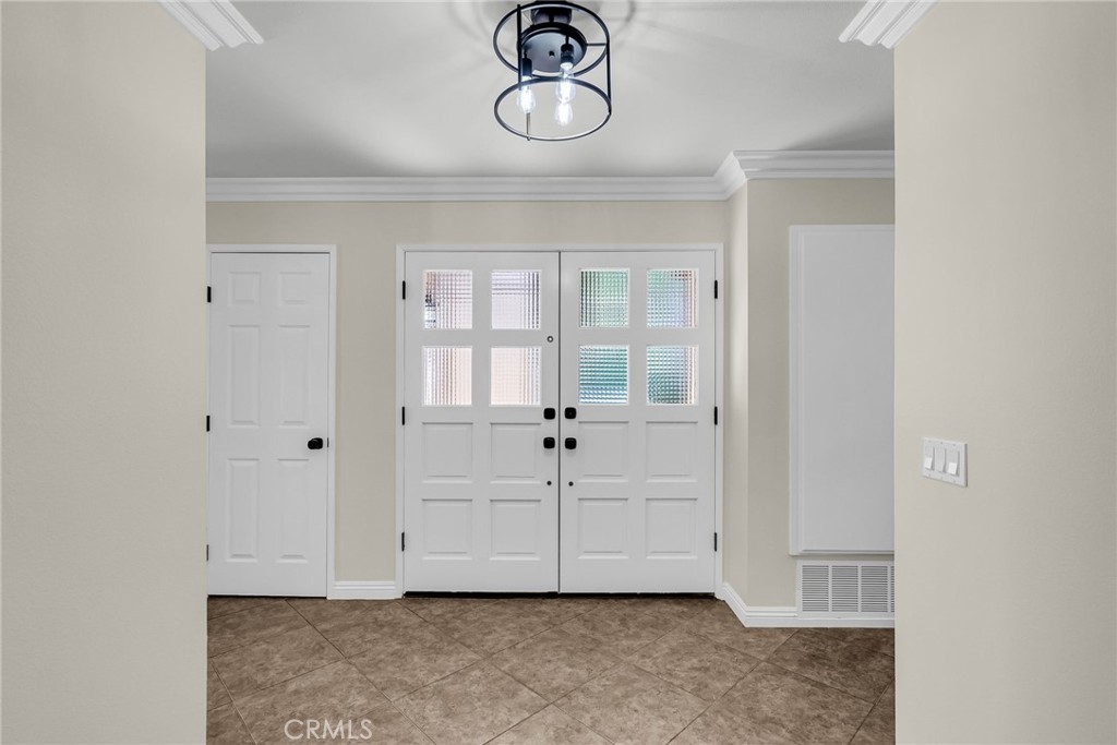 510 Vía Zapata Riverside, CA 92507 - Photo 10 of 47 a view of an empty room with chandelier fan