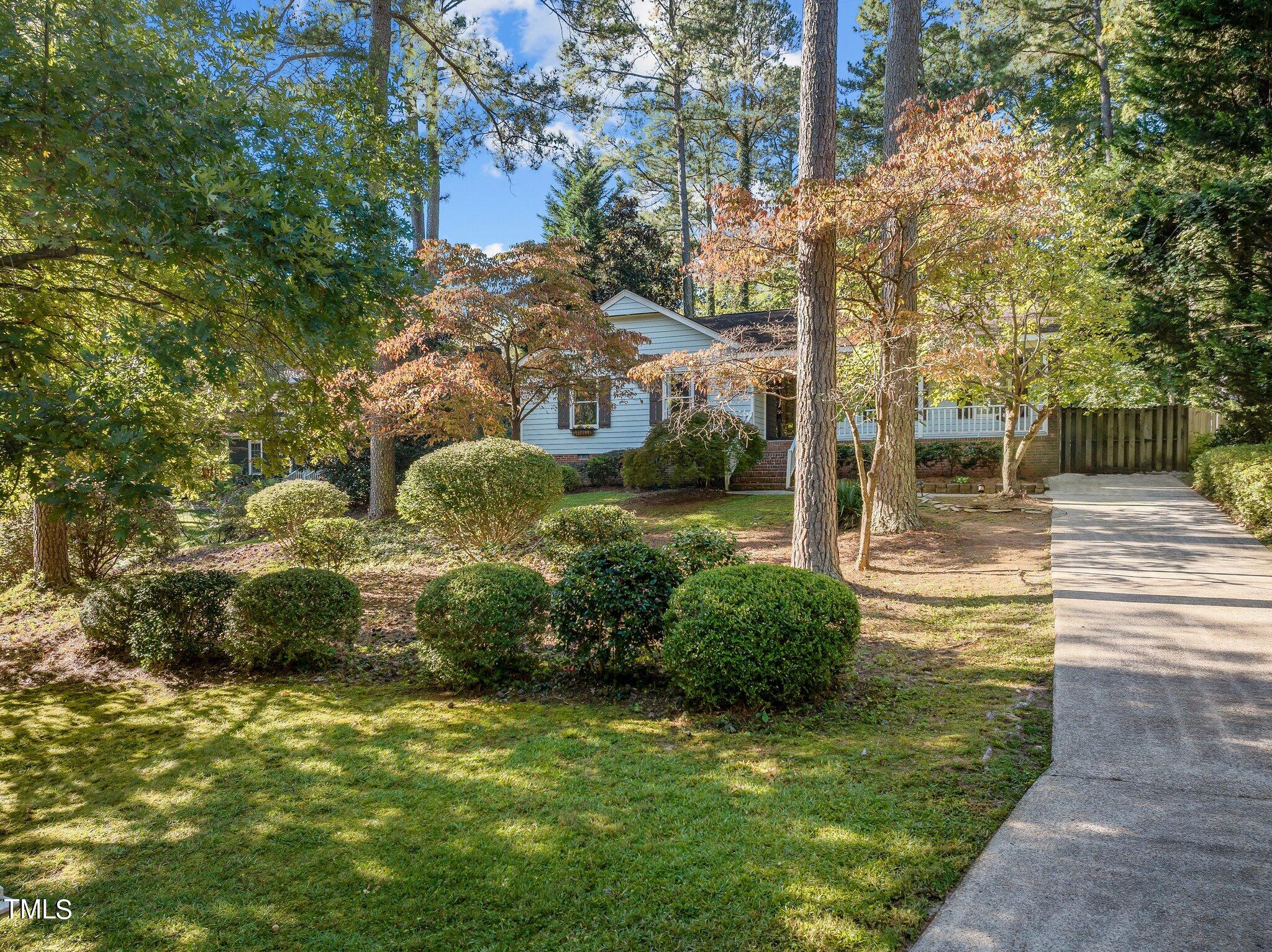 5809 Heatherbrook Circle Raleigh, NC 27612 - Photo 5 of 42 Front view in fall with the trees showing off their beautiful leaves.