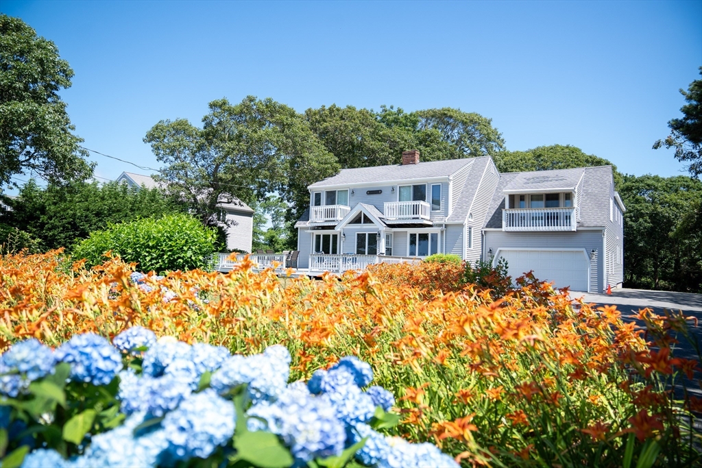 364 Lower County Road Harwich Port, MA 02646 - Photo 1 of 41 a front view of a house with a yard
