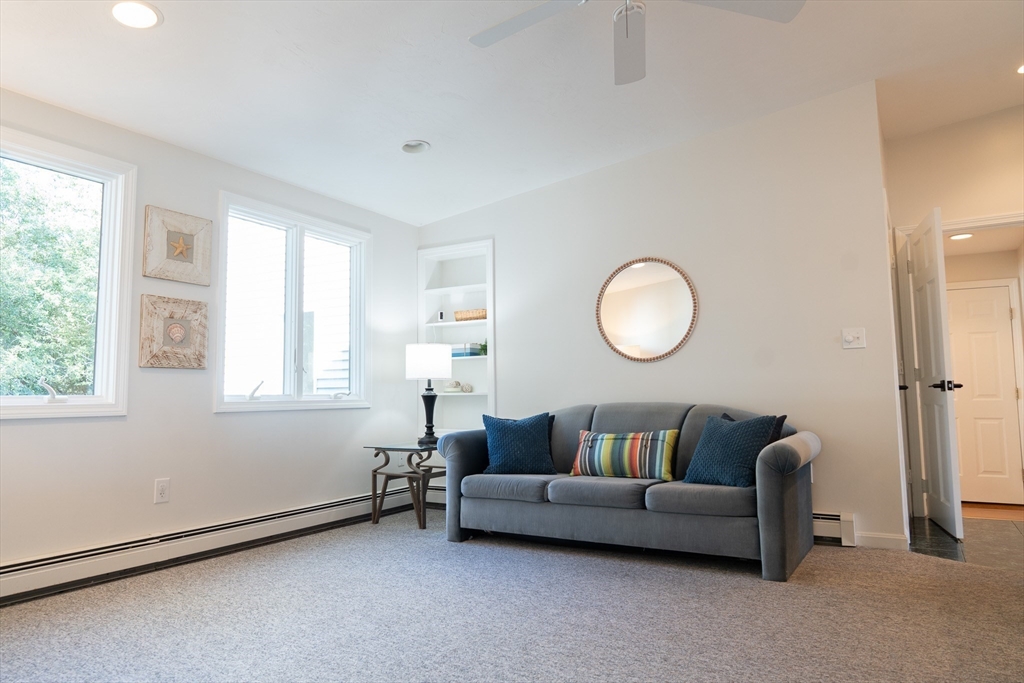 364 Lower County Road Harwich Port, MA 02646 - Photo 13 of 41 a living room with furniture and a window