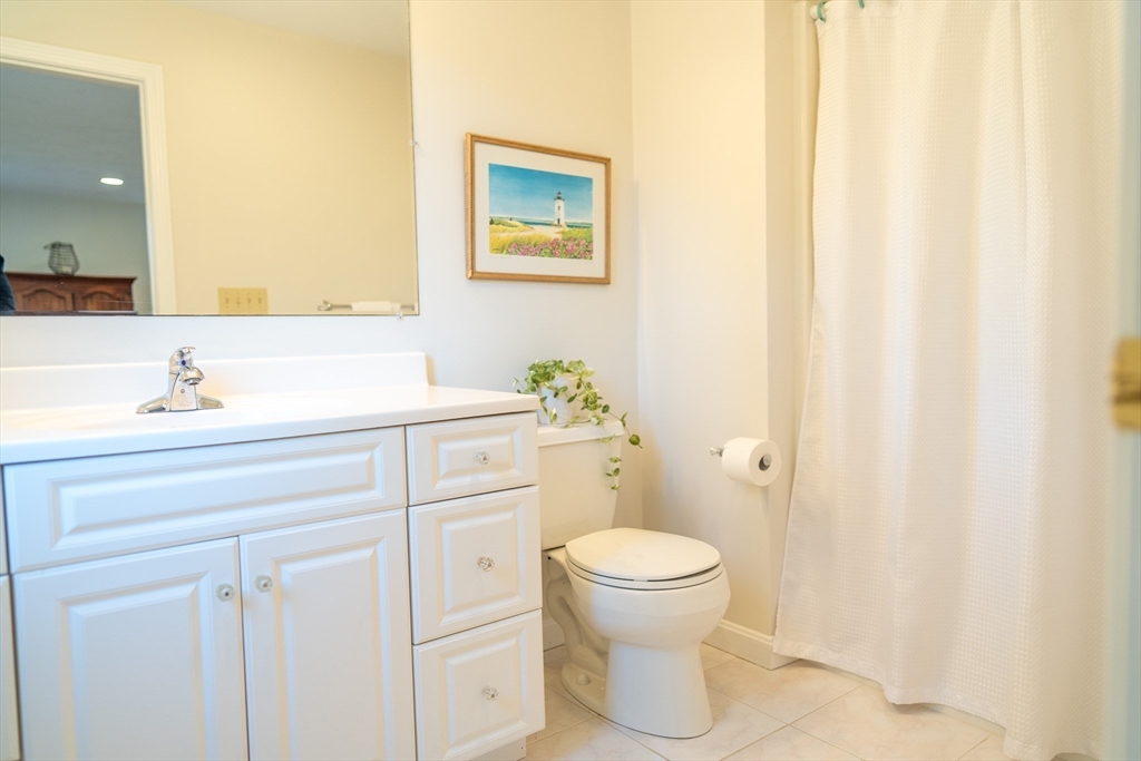 364 Lower County Road Harwich Port, MA 02646 - Photo 21 of 41 a bathroom with a sink mirror vanity and toilet