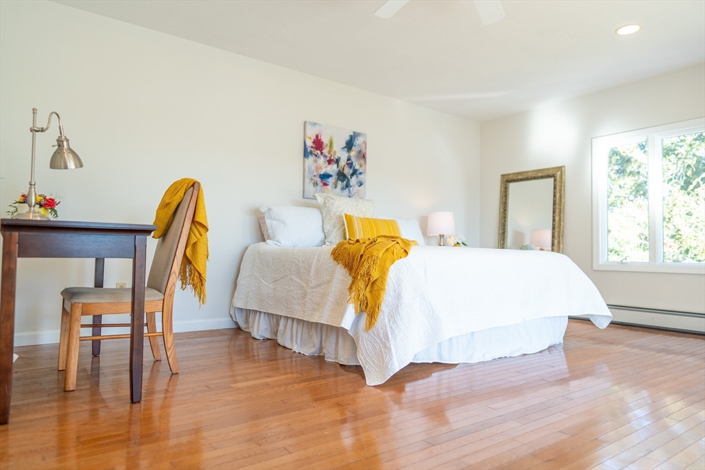 364 Lower County Road Harwich Port, MA 02646 - Photo 23 of 41 a bed room with a bed and a chair