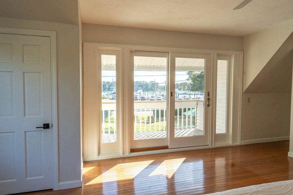 364 Lower County Road Harwich Port, MA 02646 - Photo 24 of 41 a view of an empty room with wooden floor and a window