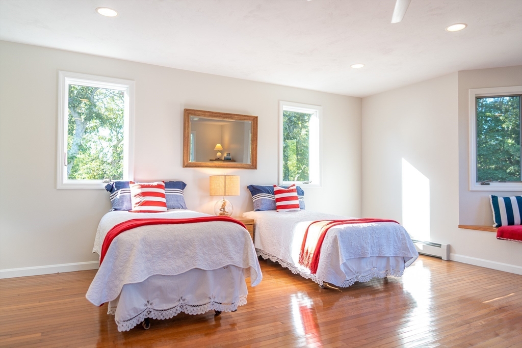 364 Lower County Road Harwich Port, MA 02646 - Photo 25 of 41 a bedroom with two beds and a potted plant