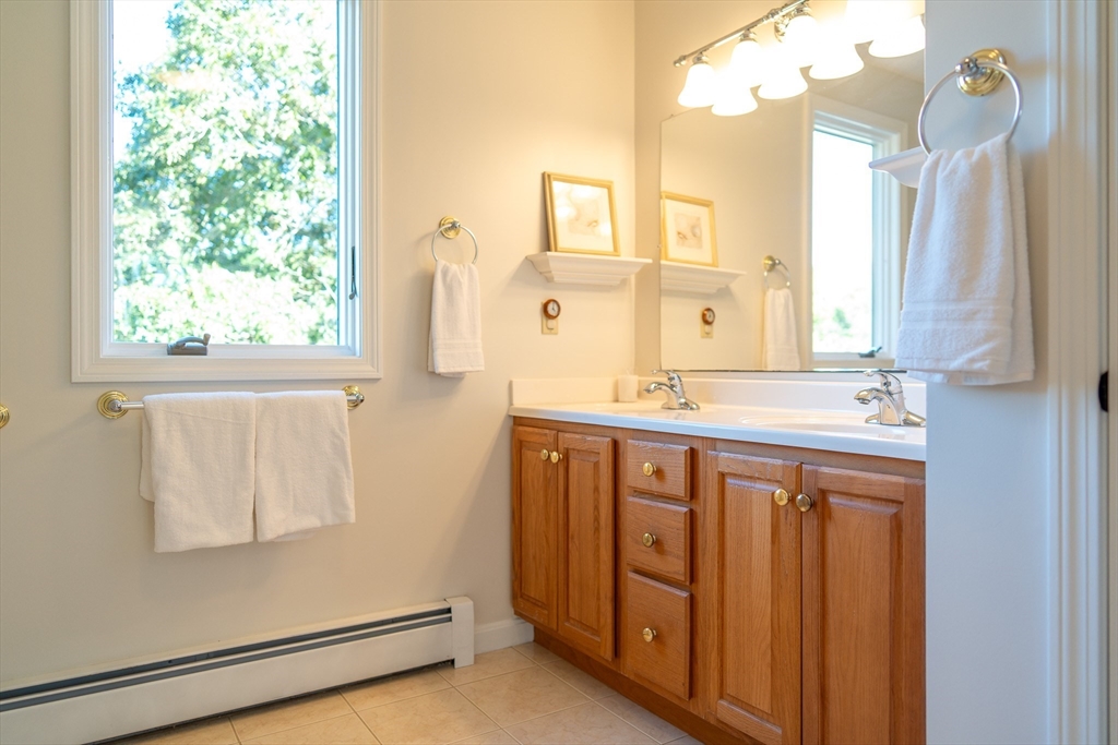364 Lower County Road Harwich Port, MA 02646 - Photo 28 of 41 a bathroom with a double vanity sink and a mirror