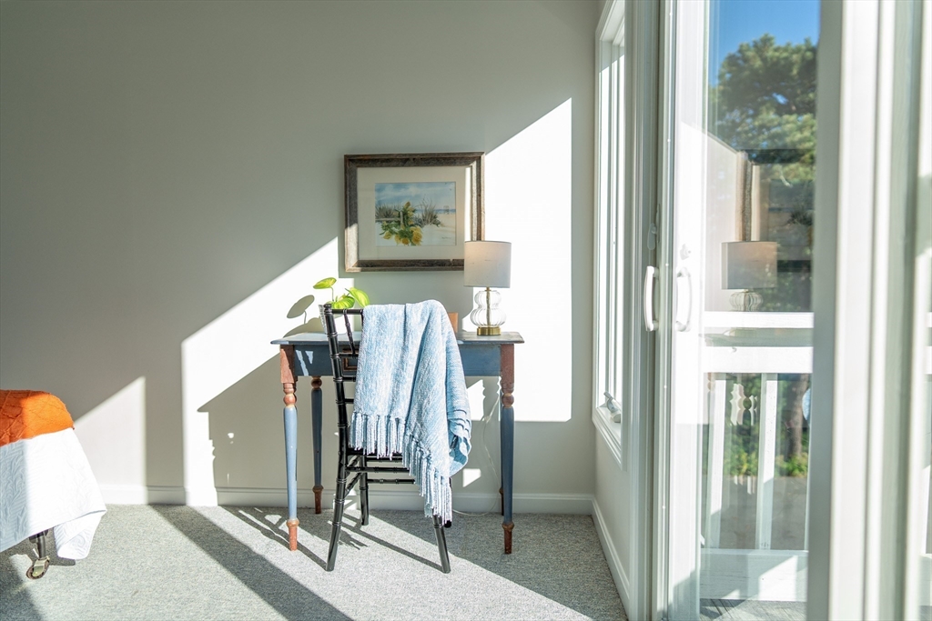 364 Lower County Road Harwich Port, MA 02646 - Photo 30 of 41 a view of walk in closet with clothes and shoes