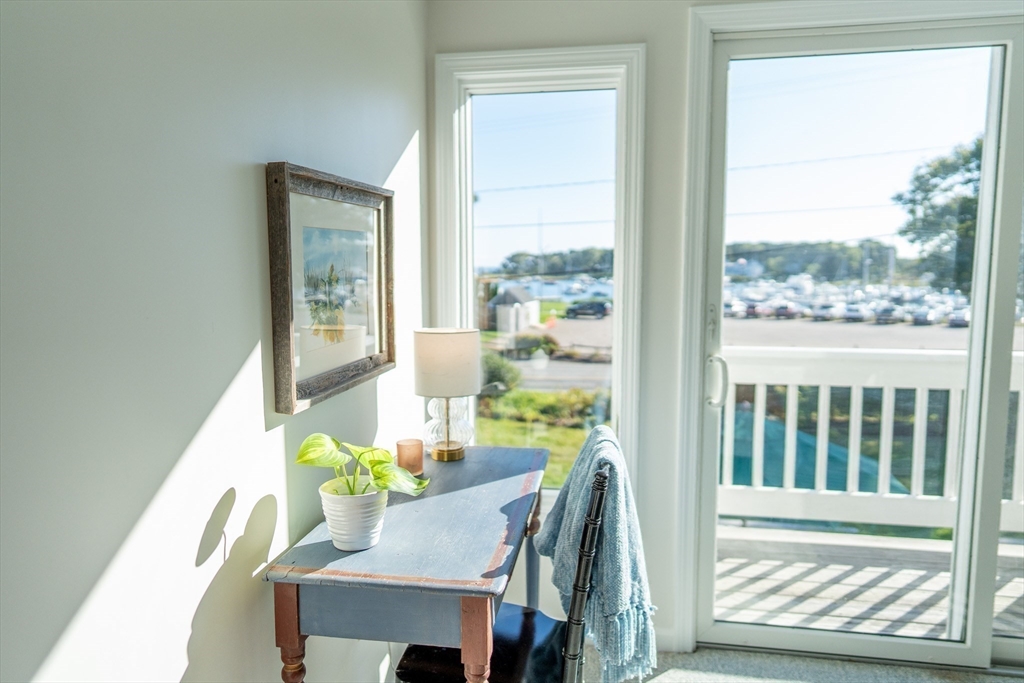 364 Lower County Road Harwich Port, MA 02646 - Photo 31 of 41 a view of a dining room with furniture a chandelier and a window