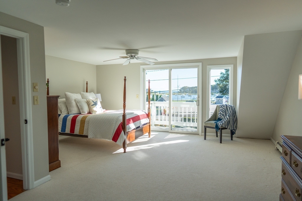 364 Lower County Road Harwich Port, MA 02646 - Photo 34 of 41 a bedroom with bed and glass door