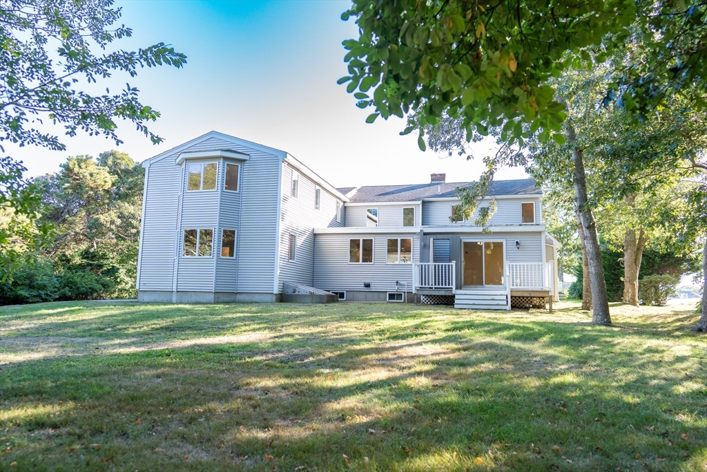 364 Lower County Road Harwich Port, MA 02646 - Photo 36 of 41 a view of a house with a big yard and large trees