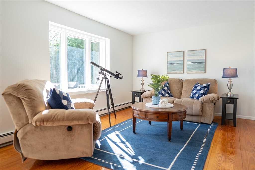 364 Lower County Road Harwich Port, MA 02646 - Photo 5 of 41 a living room with furniture and a table