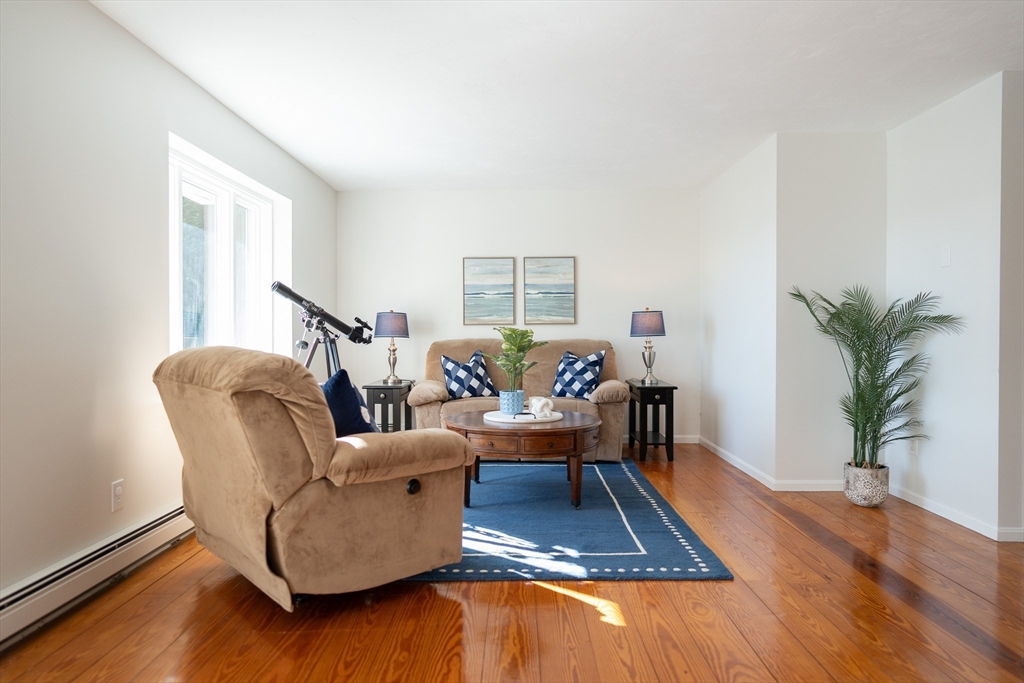 364 Lower County Road Harwich Port, MA 02646 - Photo 6 of 41 a living room with furniture and a wooden floor
