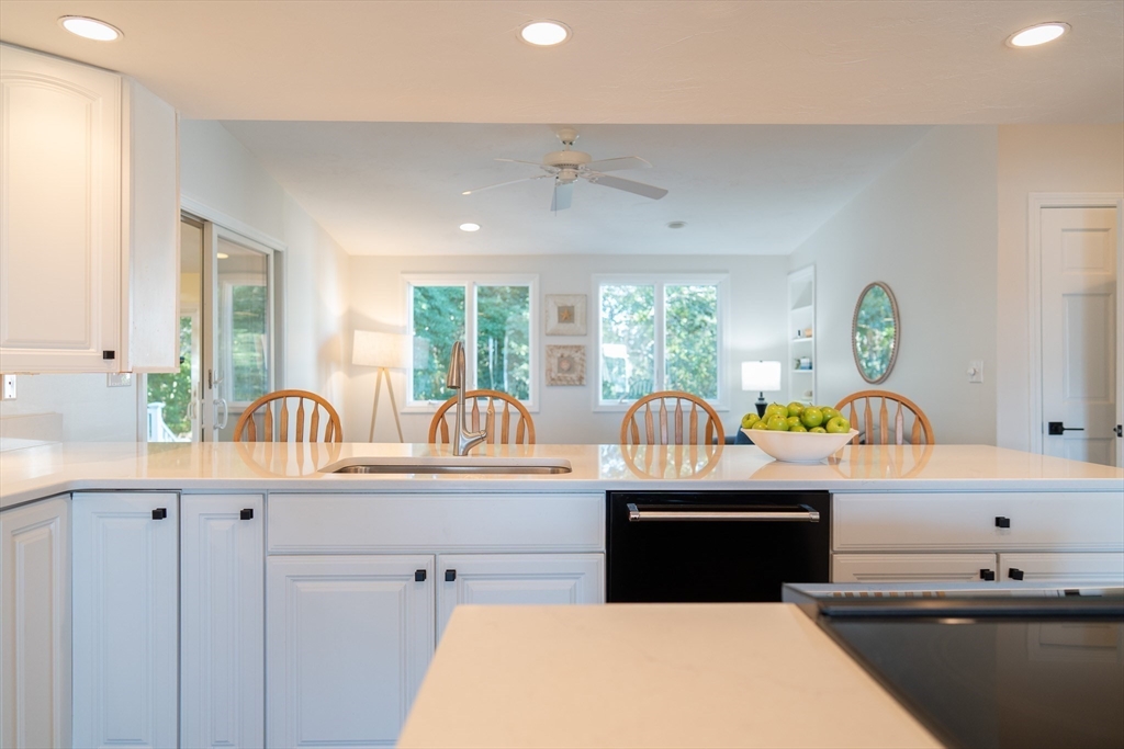 364 Lower County Road Harwich Port, MA 02646 - Photo 10 of 41 a kitchen with stainless steel appliances a sink a counter top space cabinets and furniture