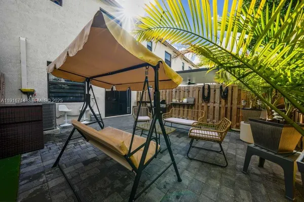 a patio with table and chairs