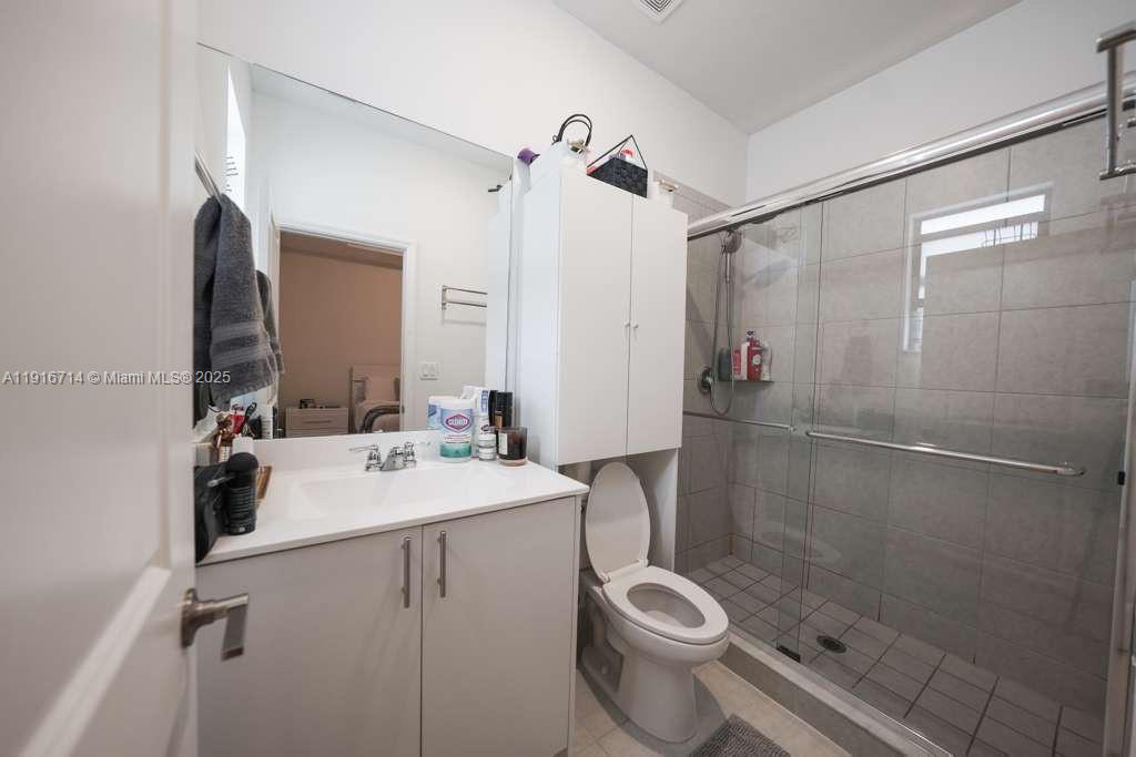 12869 Southwest 233rd Terrace Homestead, FL 33032 - Photo 20 of 30 a bathroom with a sink toilet and shower