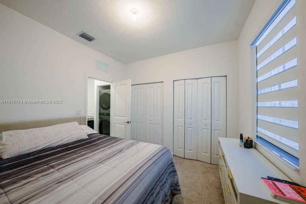 12869 Southwest 233rd Terrace Homestead, FL 33032 - Photo 21 of 30 a bedroom with a bed and a closet