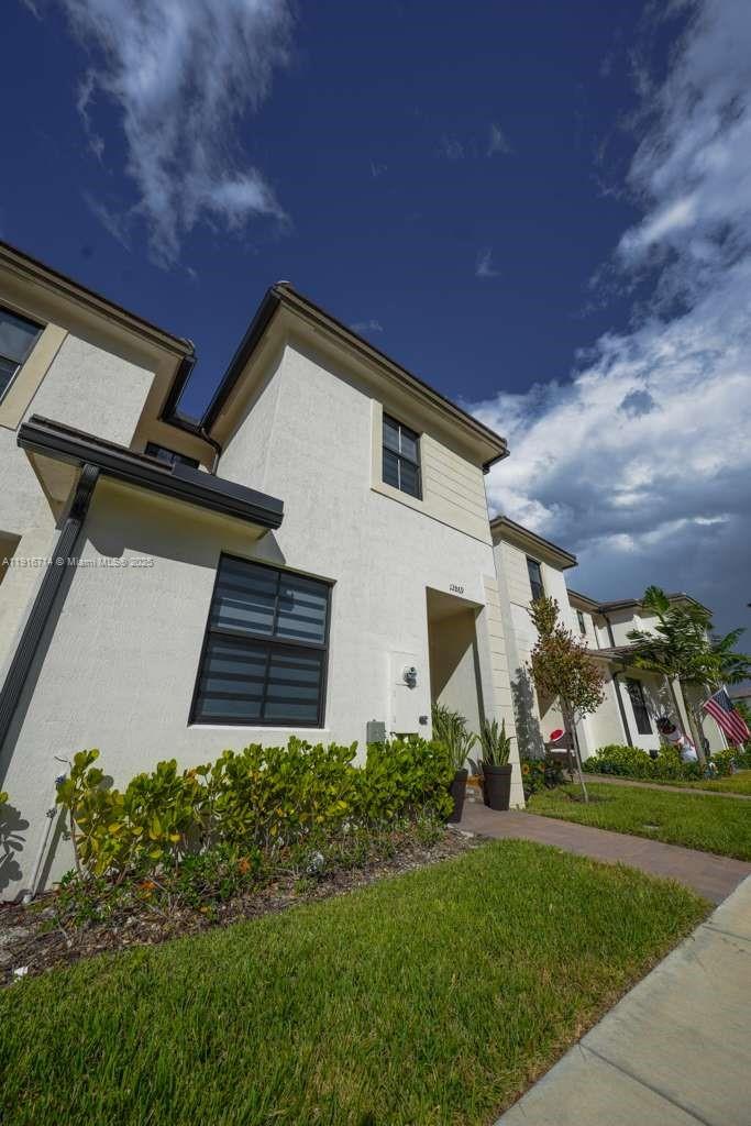 12869 Southwest 233rd Terrace Homestead, FL 33032 - Photo 30 of 30 a house view with a garden space