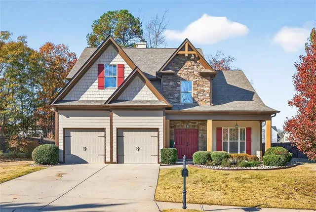 a front view of a house with garden