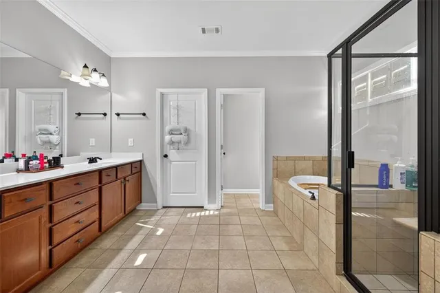 a bathroom with a bathtub and shower