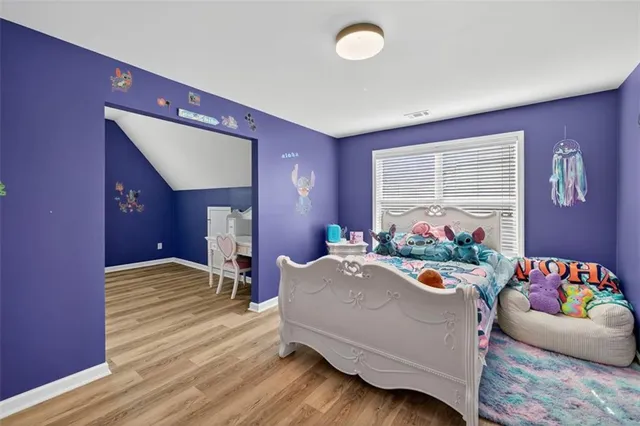 a view of an house with backyard space and sitting area
