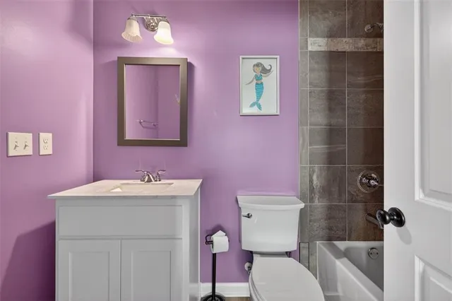 a brick building with a bench in front of it