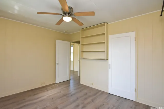 a view of an empty room with a fan